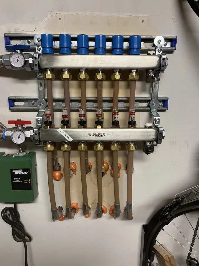 Plumber performing Water Heater Repair at a residential property in Edgewood